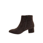 The On the Down Low Boot by CORKY’S FOOTWEAR is a dark brown suede ankle boot with a side zipper and a low block heel, shown on a white background—an elegant, low-profile choice for casual everyday wear.