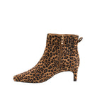 Side view of the Bad Break Up Leopard Bootie by CORKY’S FOOTWEAR, showcasing a striking leopard print ankle boot design with a mid-height block heel and a sophisticated gold side zipper.
