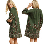 Women's abstract botanical print shift dress with split neckline, long balloon sleeves, lace trim and side pockets