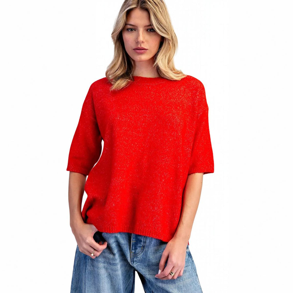 Women's marled knit short sleeve sweater with crew neckline, dropped shoulders, elbow-length sleeves, ribbed cuffs and side slit hem