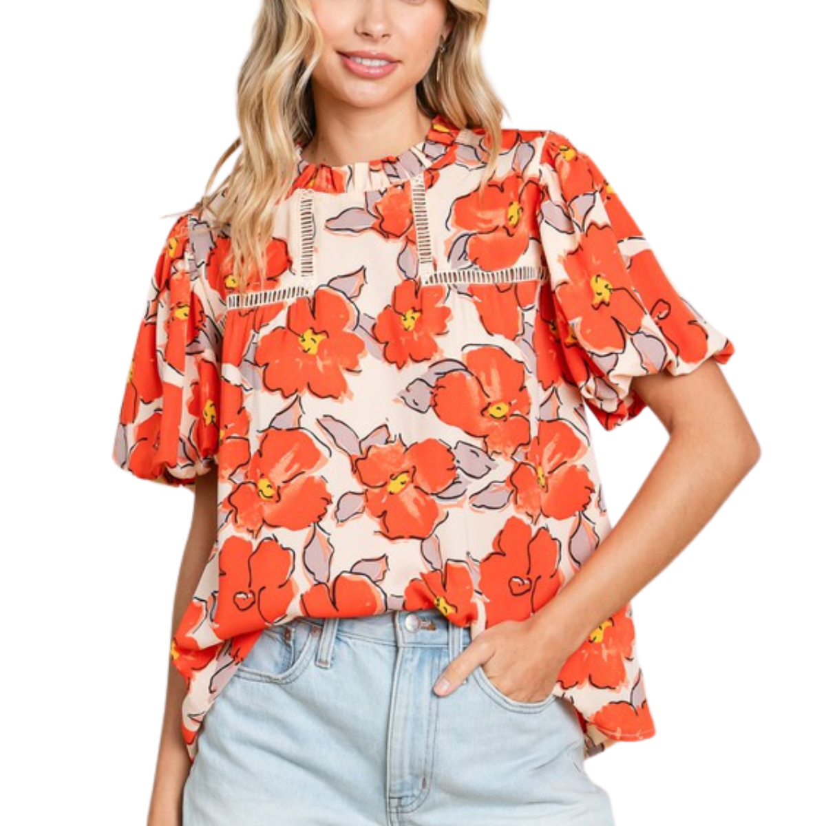 A person wearing a Flower Print Puffed Sleeves Top by FASHION GO with a red floral pattern and frilled neck, paired with light blue high-waisted jeans.