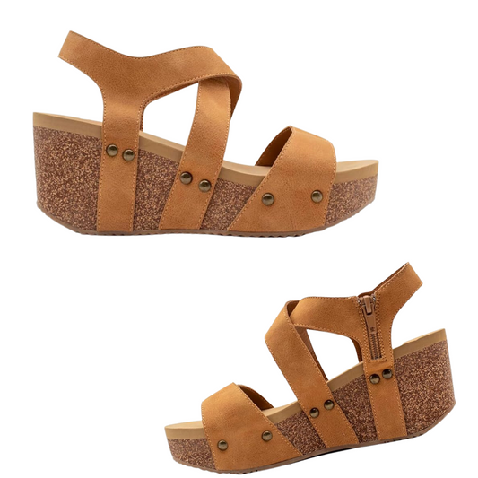 Two views of the Sunkissed Wedge Sandal in Tan by Volatile - Rosenthal & Rosenthal featuring a tan wedge with a textured brown platform and adjustable faux leather straps. The shoe includes metal accents, a side zipper for easy wearing, and an ultra comfort EVA insole.