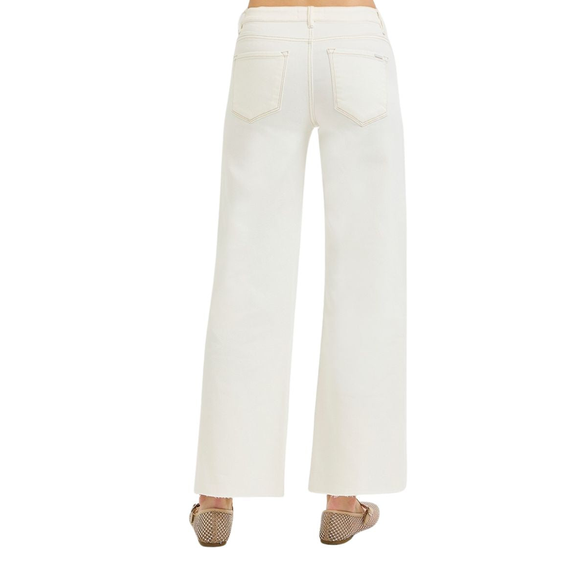 Person wearing Fashiongo Tummy Control Mid Rise Ankle Straight Raw Hew Pants and beige woven flats, photographed from the back against a plain white background.