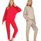 Two women wear FASHION GO Scuba Fabric Mock Neck Pullover Jogger Sets—one in red, one in beige. Both smile against a plain background. The polyester joggers provide comfortable fit for any height.