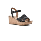 The White Mountain Simple Wedges are black strappy sandals featuring a cork platform sole and an ankle buckle strap, shown against a white background.
