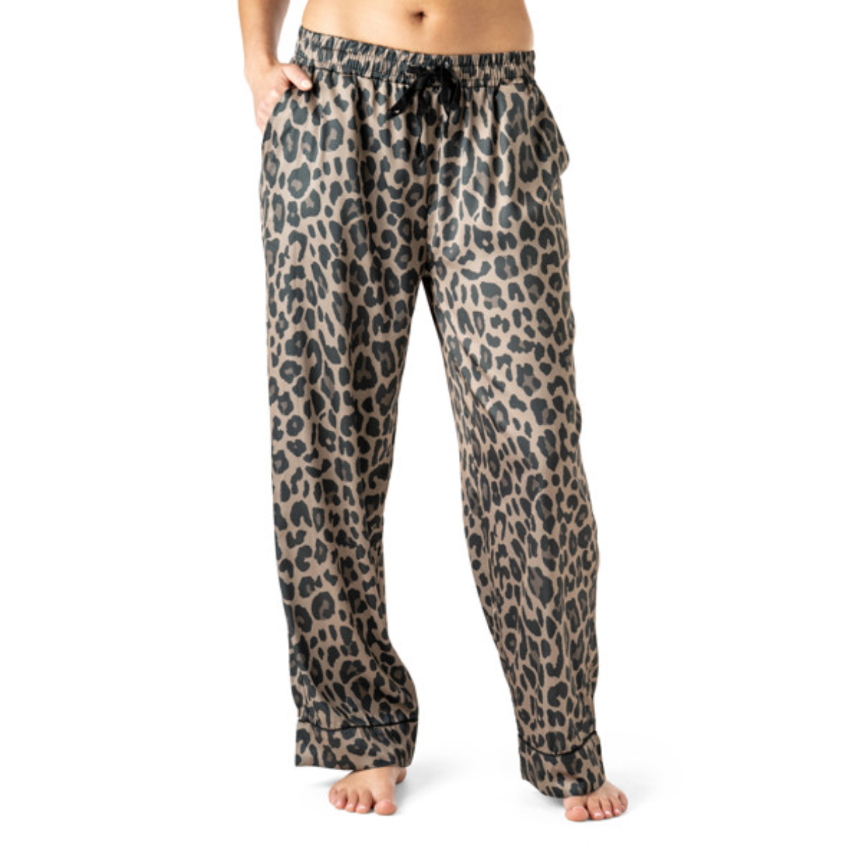 A person models Hello Mello Bow So Lovely Satin Pajama Pant by DM MERCHANDISING INC—loose-fitting, silky pants with an adjustable drawstring, barefoot against a white background for luxurious sleepwear and comfort. Main image