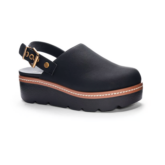 A black platform clog with a brown strap and buckle, featuring a thick brown midsole and a textured black outsole. These comfy and casual Mojo Clog in Black by Chinese Laundry boast a 2.25" heel, perfect for everyday wear.