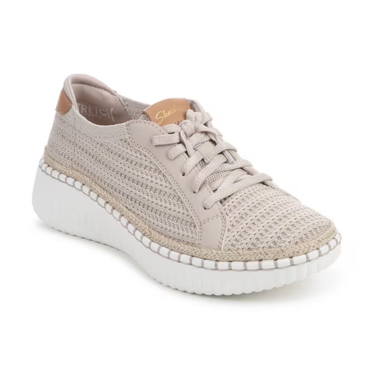 The SKECHERS Wilshire Boulevard Passion Play is a beige knit sneaker with a white sole, lace-up front, and tan accents on the tongue and heel. It’s machine washable for easy care.