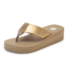 The Yellow Box Leyla Wedge Flip Flop Sandal features a tan wedge, wide metallic gold strap, and cushioned, impact-reducing footbeds inspired by Mellow Mat sandals, shown on a white background.