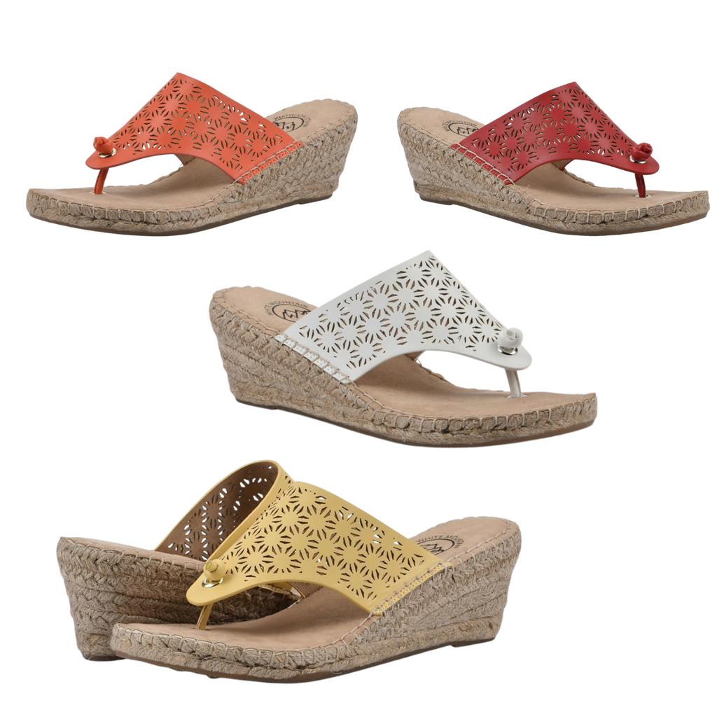 The White Mountain Beaux Espadrille Wedge, available in red, orange, white, and yellow with cutout flower patterns and comfy wedge heels, is stylishly displayed on a white background—perfect for women’s fashion.