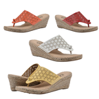 The White Mountain Beaux Espadrille Wedge, available in red, orange, white, and yellow with cutout flower patterns and comfy wedge heels, is stylishly displayed on a white background—perfect for women’s fashion.