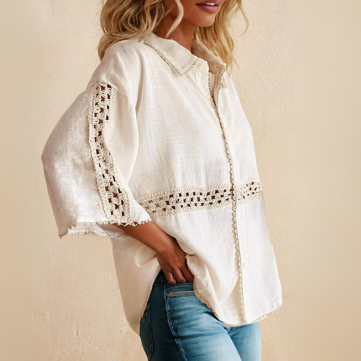 A person wearing the FASHION GO Crochet Detail Half Sleeve Scallop Edge Shirt, paired with blue jeans.