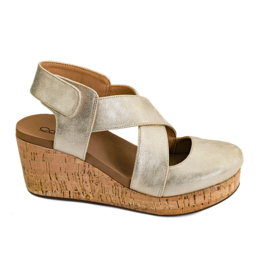 The Case Closed Closed Toe Wedge in Gold by CORKY'S FOOTWEAR INC features a 3" wedge heel, cork platform, and velcro ankle strap for easy wear.