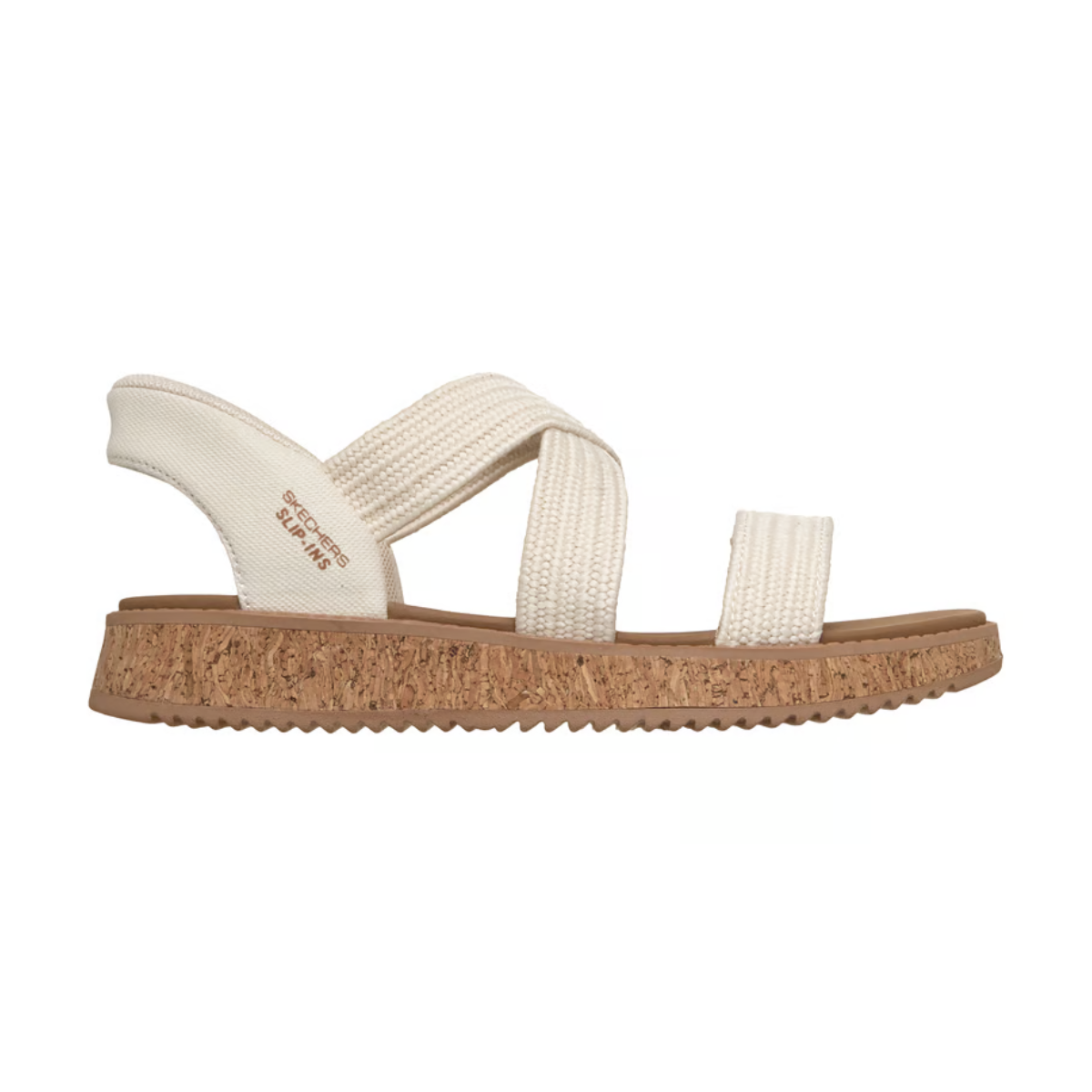 The SKECHERS Slip-ins: BOBS Sun Vibe - Island Stroll is a beige sandal with textured fabric straps, cushioned footbed, and cork-textured sole, shown in side profile against a white background.