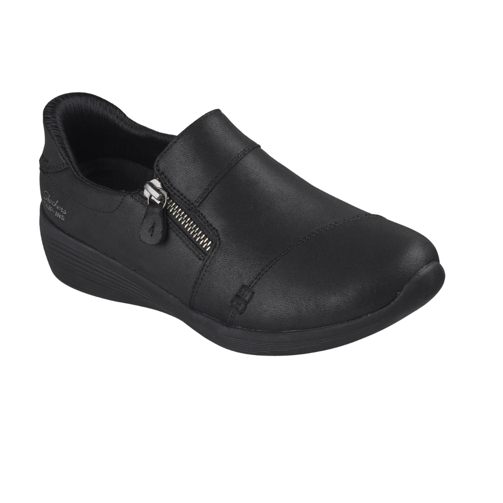 The SKECHERS Silvana Black Slip Ins Sneaker is a hands-free slip-on shoe with a side zipper, low wedge heel, and smooth upper material. Featuring Air-Cooled Memory Foam for all-day cushioning, it is displayed on a white background.