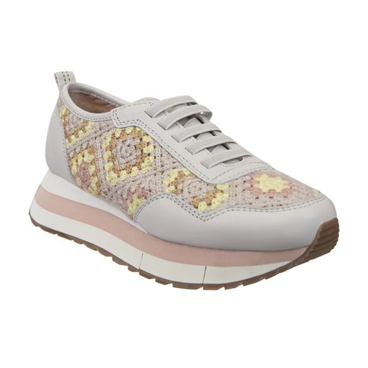 The KINETIC in PATCHWORK Platform Sneakers by Consolidated Shoe Co feature a lace-up design, multicolor crocheted upper in yellow, gray, and beige, light gray trim, and a thick white and pink sole for an artisanal look.