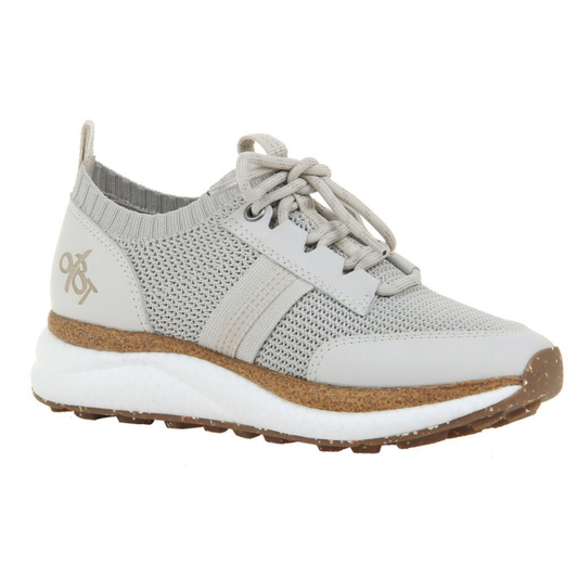 The Speed Sneakers in Mist by OTBT from Consolidated Shoe Co feature a light gray knit upper, lace-up closure, beige accents, and a speckled brown recycled rubber sole with a white midsole.