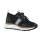 The Speed Sneakers in Black by OTBT from Consolidated Shoe Co feature a white sole, gray side stripes, a cork accent above the midsole, black laces, and a recycled rubber lug sole, shown on a plain white background.