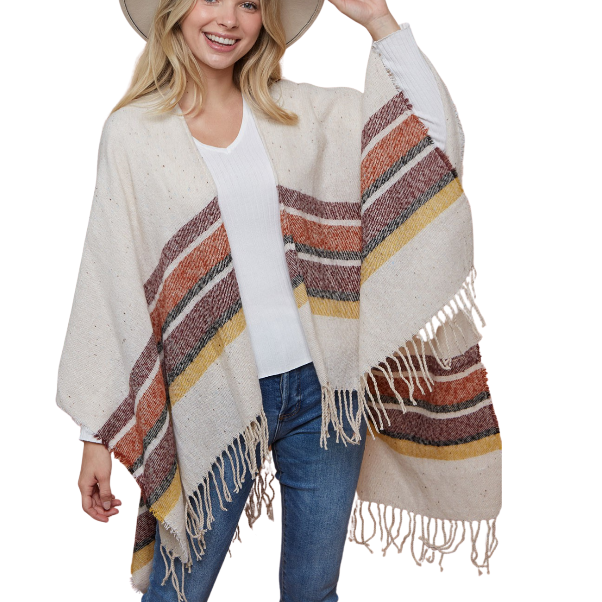 A woman wearing a wide-brim hat and the FASHION GO Striped Wrap with fringe over a white shirt and blue jeans smiles while holding her hat.