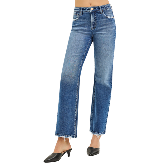 A woman models FASHION GO’s Tummy Control High Rise Ankle Straight Jeans with Distressed Pockets & Hem in stretch denim, styled with black heeled mules, shown from waist down against a white background.