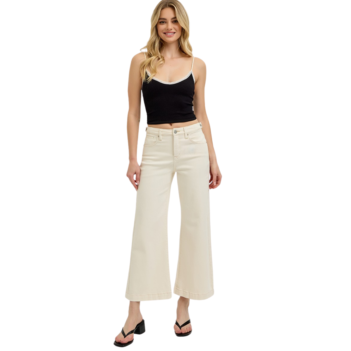 A woman wearing a black tank top, black sandals, and FASHION GO's Tummy Control High Rise Wide Adjustable Waistband pants in Ivory smiles against a white background.