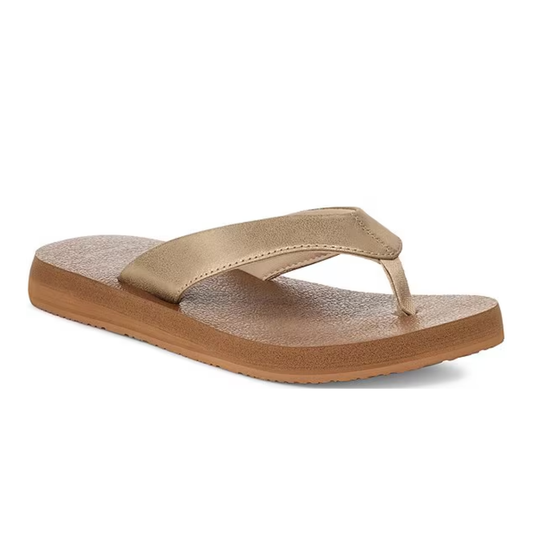 The Lole Brands Yoga Mat II Metallic Flip Flop features a wide gold-tone strap, brown textured sole, and cushioned footbed for comfort, shown against a white background.