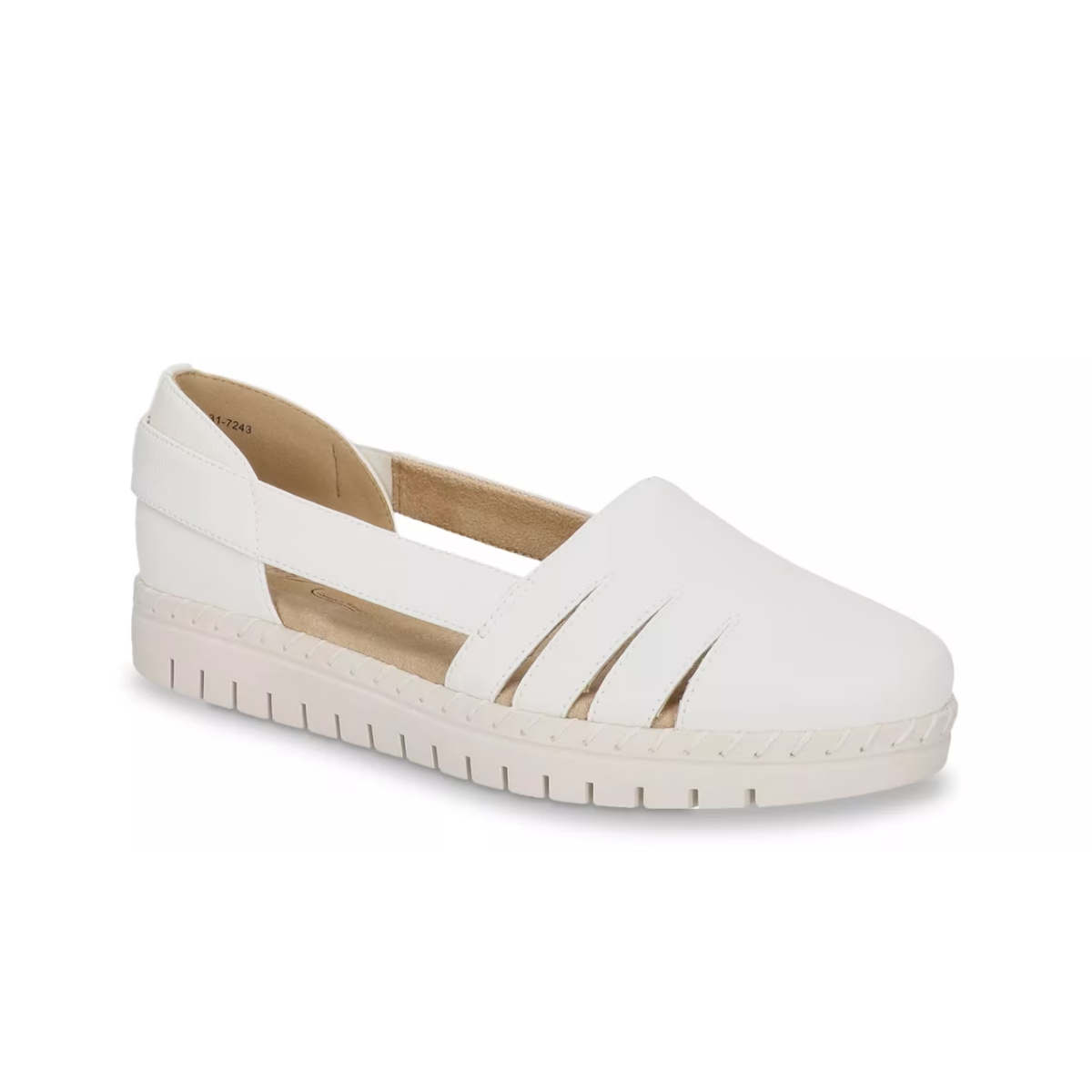 The EASY STREET Easy Street Bugsy Slip On in White features cut-out sides, a closed toe, padded insole, and a thick textured sole for support.