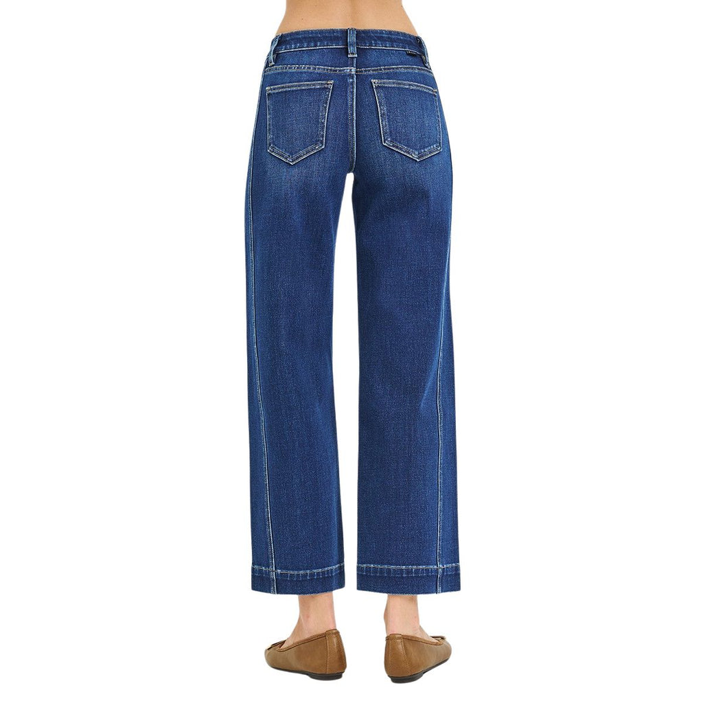 Person wearing FASHION GO Mid Rise Ankle Wide Leg Jeans in dark wash and brown flats, shown from the back on a plain white background.