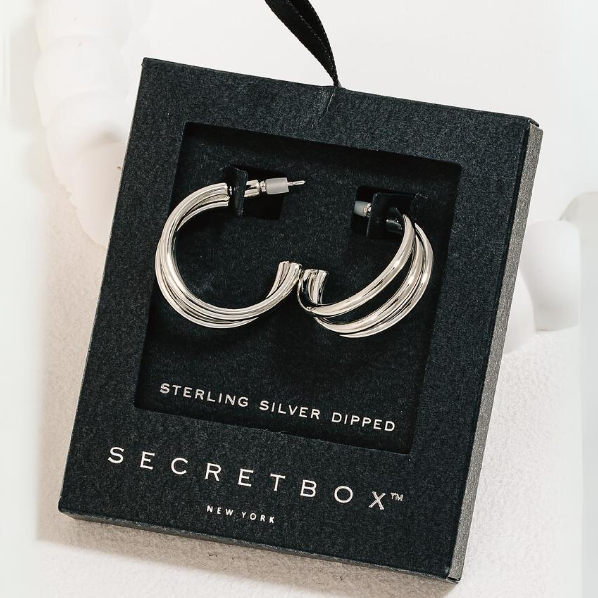 A pair of Secret Box Gold Dipped Layered Tube Hoop Earrings in Silver in black packaging labeled "FASHION GO," featuring a stylish layered tube style design. Main image