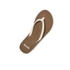 A single Yoga Joy 2 Ladies Flip Flop in White by SANUK - DECKERS, featuring white straps and a comfy memory foam footbed, shown on a white background.