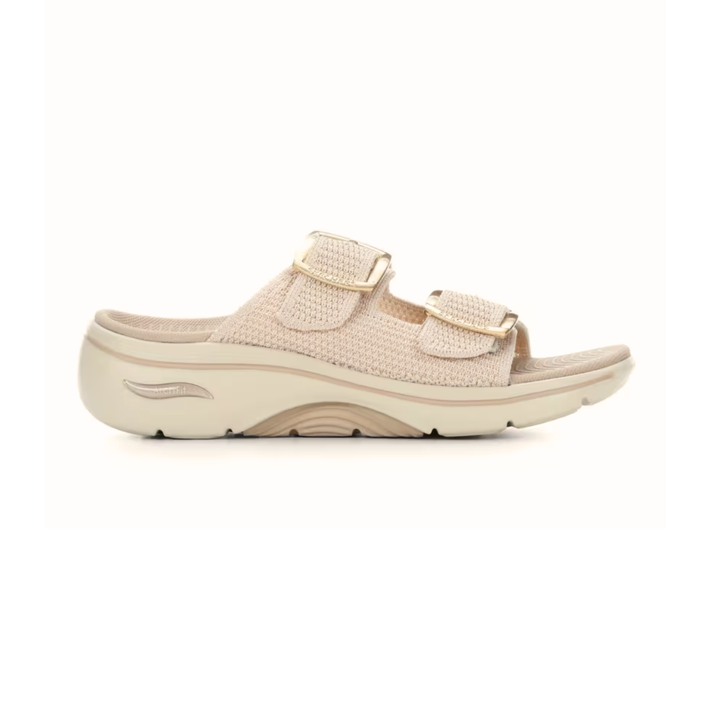 The SKECHERS Go Walk Arch Fit Chloe sandal in beige features a textured upper, two adjustable buckle straps, and a thick contoured sole with arch support—shown in profile against a white background.