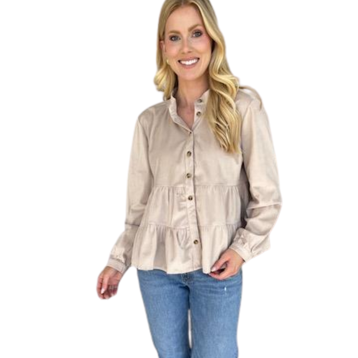 A woman wearing the Carole Christian Corduroy Tier Top, a buttery soft, light beige button-front blouse with long sleeves, paired with blue jeans, stands and smiles against a white background.