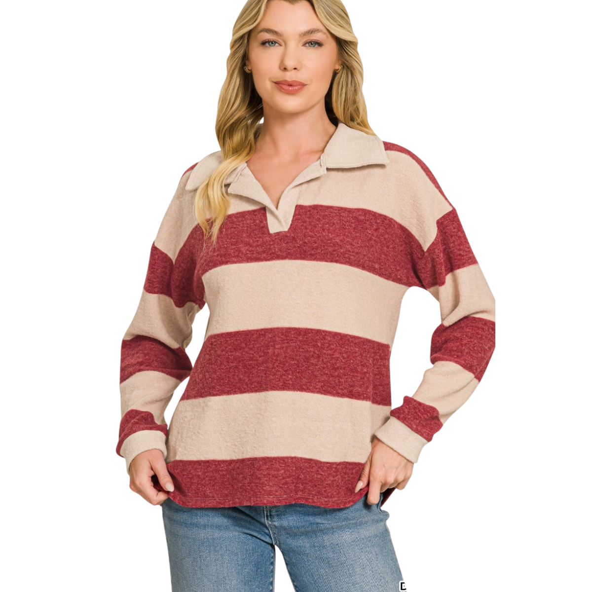 A woman stands against a white background with one hand on her hip, wearing the FASHION GO Brushed Hacci Collared Top—a cozy, lightweight red and beige striped sweater—paired with blue jeans.