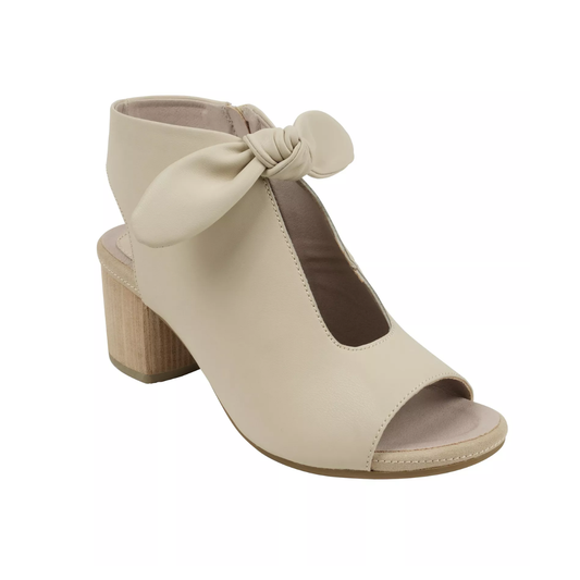 The Kimora Block Heel Peep Toe Shoe in Nude by Good Choice features an ankle strap, oversized bow detail, wooden block heel, and a comfortable fit.