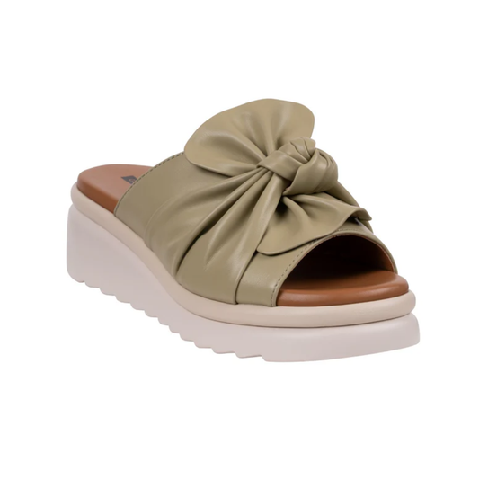 The Good Choice Harlow Sage Green Platform Comfort Sandal features a large knotted bow, cushioned memory foam footbed, and a trendy white platform sole.