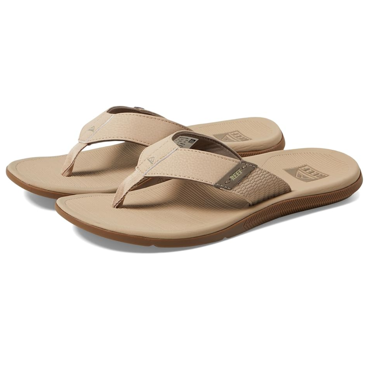 A pair of Men's Reef Santa Ana Flip Flops in Sand by REEF, featuring textured straps and molded footbeds for high arch support, displayed on a plain white background.