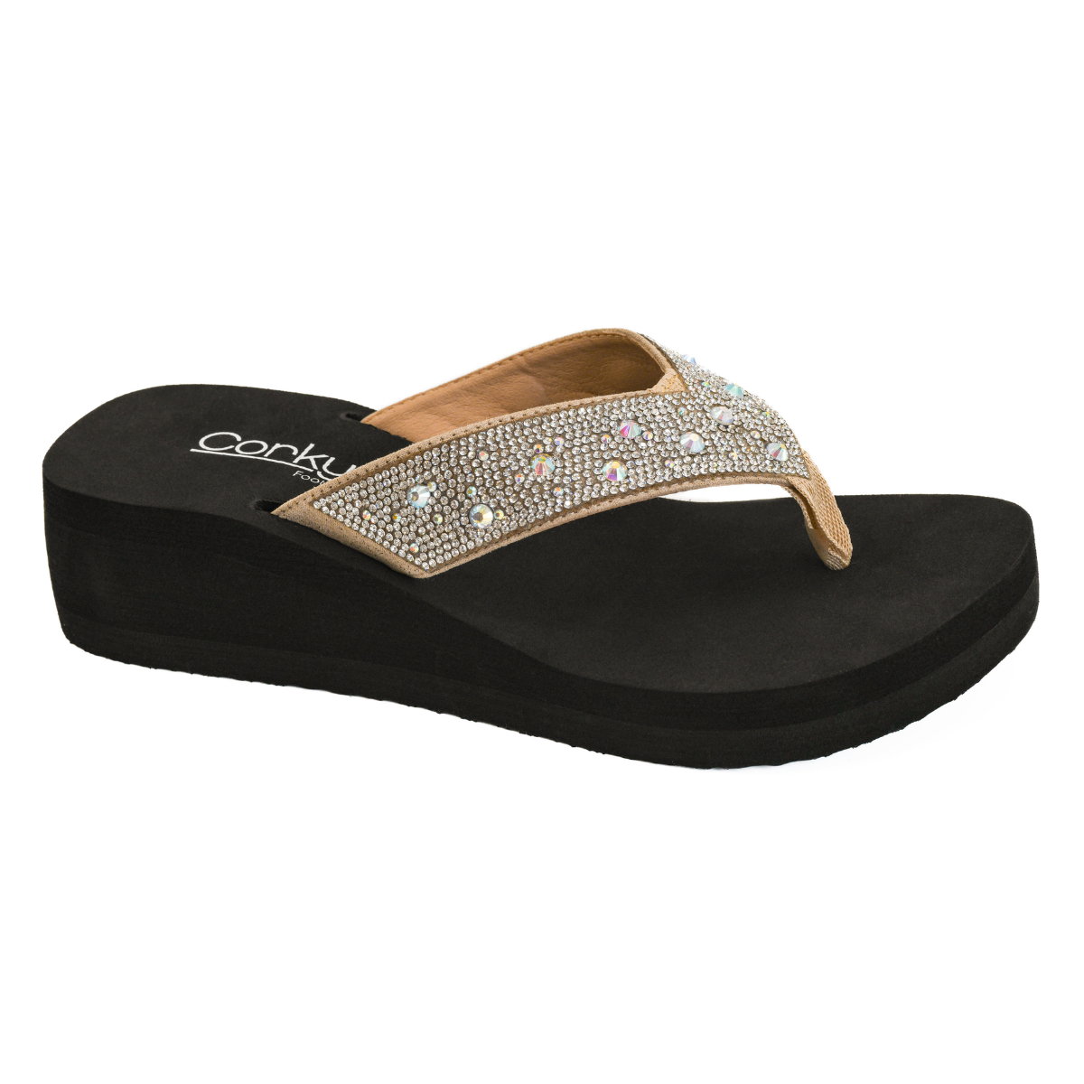 The Dime A Dozen Wedge Flip Flop by CORKY'S FOOTWEAR INC features a black sole, tan rhinestone-studded strap, and cushioned footbed for comfort. Main image