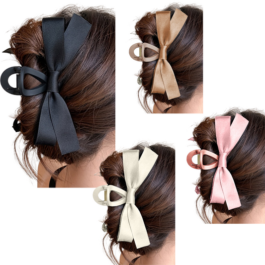 Four hair buns adorned with large ribbon bows in black, brown, cream, and pink shades. The hair is styled up with the Hair Claw Clip with Side Bows by Flipflops & Whatnots attached at the back.