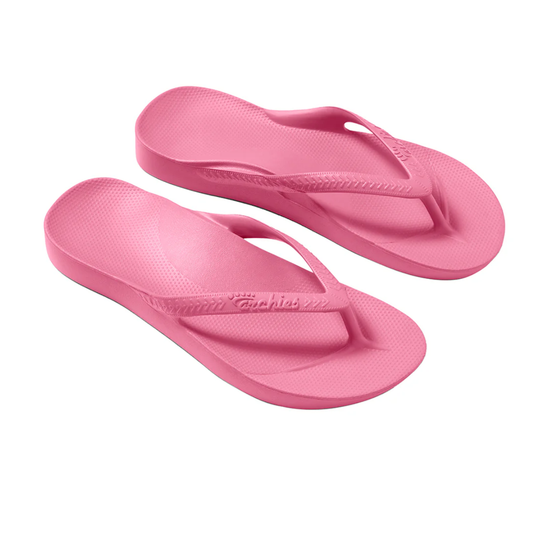 The ARCHIES Flip Flop in Hot Pink features textured soles, wide straps, and built-in arch support for enhanced comfort, shown on a white background.
