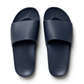 The Archies Slide Sandal in Navy by ARCHIES FOOTWEAR LLC features a wide strap and textured footbed, shown from above against a white background.