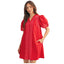 The woman is wearing the FASHION GO Short Puff Sleeves Embroidered Shift Dress, featuring red cotton fabric with white decorative stitching and convenient pockets, as she stands against a plain background.