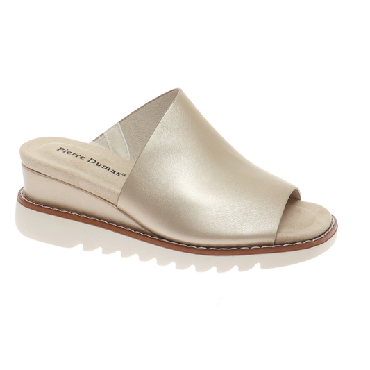 Side view of the Expand Wedge Slide Sandal in Soft Gold by OLEM SHOE CORP, featuring a thick sole, cushioned footbed, and branded insole.