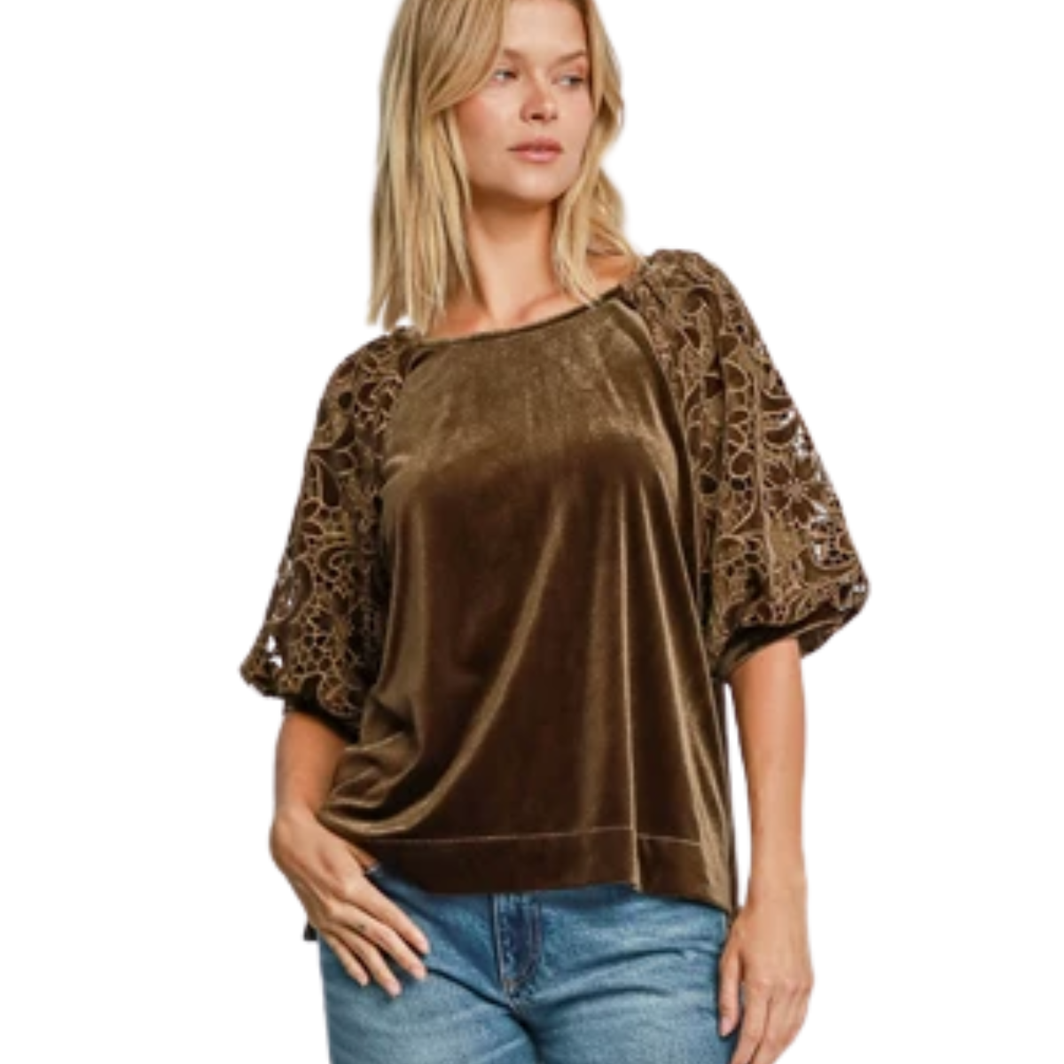 A woman wears the Umgee Brown Velvet Top with Lace Sleeves and blue jeans, standing with one hand in her pocket.