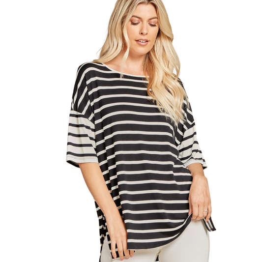 A woman stands against a white background wearing the FASHION GO Striped T shirt Top, a casual chic black and white piece with elbow-length sleeves made from a soft rayon-spandex blend.