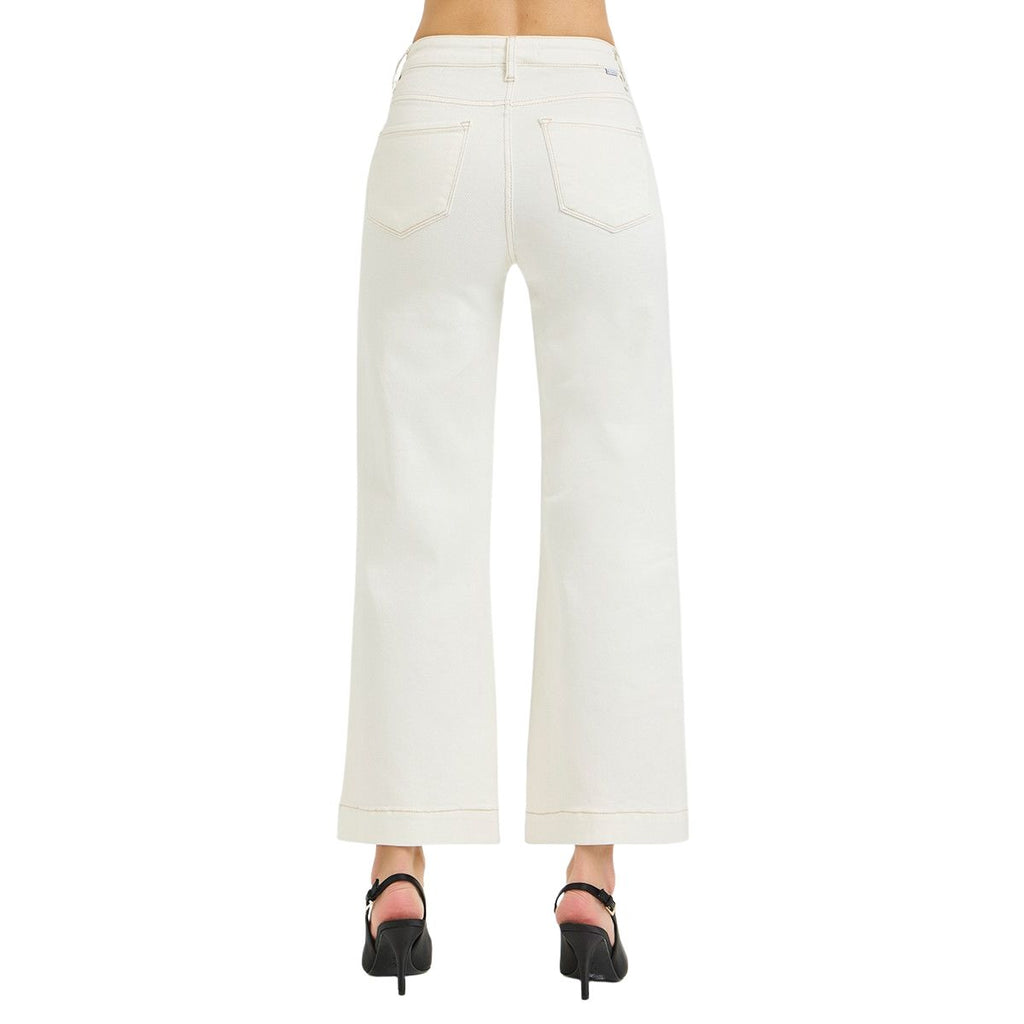 Model wearing Fashiongo Tummy Control High Rise Crop Wide Pants in white with black high-heeled shoes, shown from the back on a plain white background.