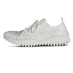 The BERNIE MEV Gravity White Sneakers with Crystal are featured in a side profile on a plain white background, showcasing their white slip-on design, textured sole, sparkling rhinestone embellishments, and comfortable memory foam footbed.