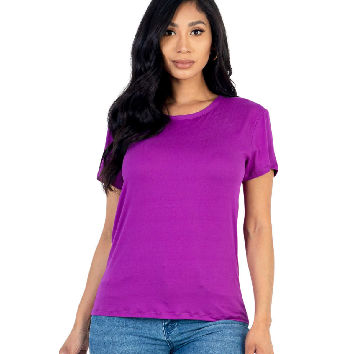 A woman wears the FASHION GO Basic Short Sleeve T-shirt in purple with a relaxed fit and blue jeans, standing against a white background—a true wardrobe staple.
