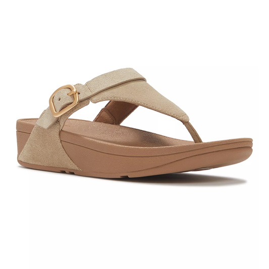 The LULU Buckle Suede Toe-Post Sandals by FITFLOP USA LLC feature a beige suede strap, gold buckle, and brown contoured sole. Shown from the side. Awarded the APMA Seal of Acceptance for comfort and support.