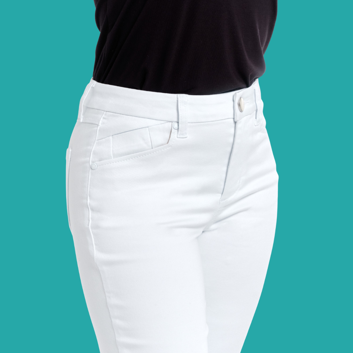 Model wears FASHION GO 30" inseam Better Butter White Jeans with a black top, shown from mid-torso to upper thighs against a solid teal background.