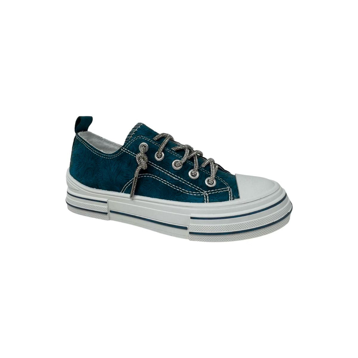 Displayed on a plain white background is the Aman Navy Tooled Sneaker by VERY G, featuring a navy upper with white toe cap, thick white sole, and sparkling rhinestone shoelaces. This Western-inspired sneaker is adorned with subtle tooled floral detailing for added charm. Main image
